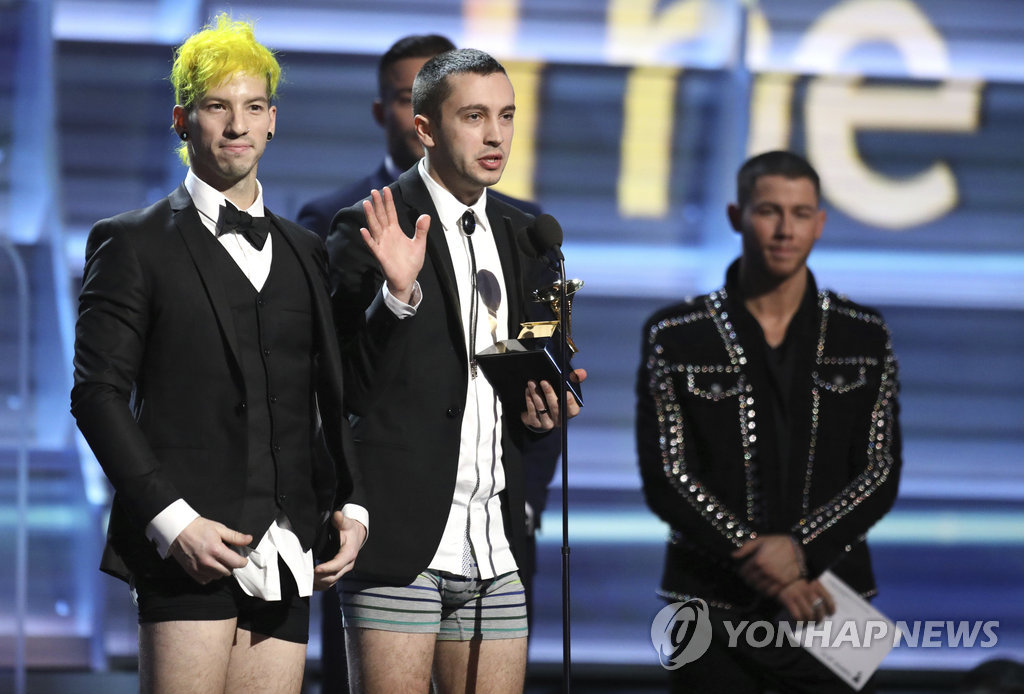 ▲ Josh Dun, left, and Tyler Joseph of "Twenty One Pilots" appear onstage without pants to accept the award for best pop duo/group performance for "Stressed Out" at the 59th annual Grammy Awards on Sunday, Feb. 12, 2017, in Los Angeles.