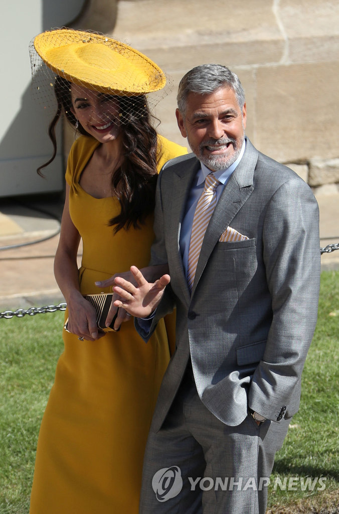 ▲ Amal Clooney and George Clooney arrive at St George's Chapel in Windsor Castle for the wedding of Prince Harry and Meghan Markle. Saturday May 19, 2018. Andrew Milligan/Pool via REUTERS