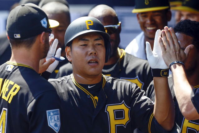 ▲ Mar 10, 2019; Tampa, FL, USA; Pittsburgh Pirates third baseman Jung Ho Kang (16) celebrates with teammates after a solo home run during the third inning against the New York Yankees at George M. Steinbrenner Field. Mandatory Credit: Butch Dill-USA TODAY Sports