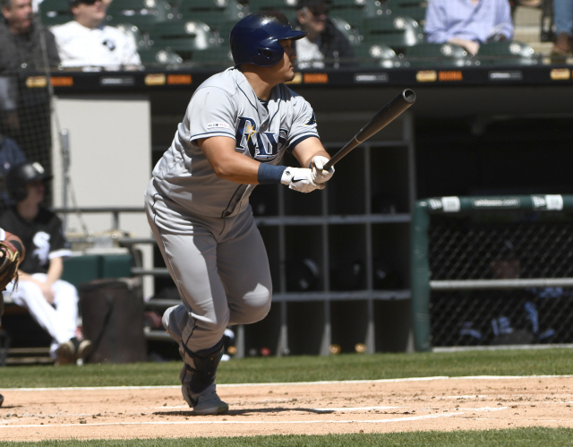 ▲ Apr 8, 2019; Chicago, IL, USA; Tampa Bay Rays first baseman Ji-Man Choi (26) hits a sacrifice RBI against the Chicago White Sox in the first inning at Guaranteed Rate Field. Mandatory Credit: Matt Marton-USA TODAY Sports