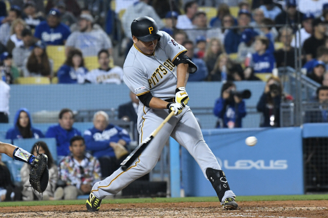 ▲ Apr 26, 2019; Los Angeles, CA, USA; Pittsburgh Pirates shortstop Jung Ho Kang (16) hits a ball off Los Angeles Dodgers starting pitcher Hyun-Jin Ryu (not pictured) during the sixth inning at Dodger Stadium. Mandatory Credit: Richard Mackson-USA TODAY Sports