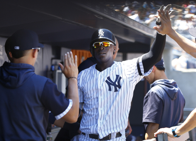 ▲ Jun 26, 2019; Bronx, NY, USA; New York Yankees shortstop Didi Gregorius (18) celebrates in the dugout after hitting a home run against the Toronto Blue Jays in the second inning at Yankee Stadium. Mandatory Credit: Noah K. Murray-USA TODAY Sports
