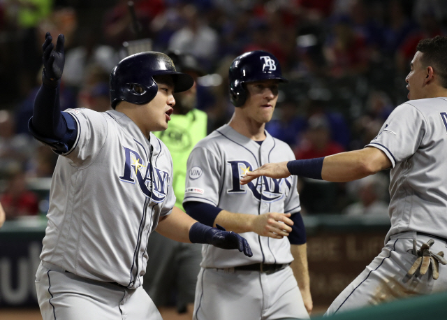 ▲ Sep 11, 2019; Arlington, TX, USA; Tampa Bay Rays first baseman Ji-Man Choi (26) celebrates with shortstop Willy Adames (1) after hitting a three-run home run during the second inning against the Texas Rangers at Globe Life Park in Arlington. Mandatory Credit: Kevin Jairaj-USA TODAY Sports