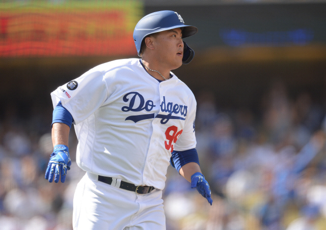 ▲ September 22, 2019; Los Angeles, CA, USA; Los Angeles Dodgers starting pitcher Hyun-Jin Ryu (99) runs the bases after hitting a solo home run against the Colorado Rockies during the fifth inning at Dodger Stadium. Mandatory Credit: Gary A. Vasquez-USA TODAY Sports
