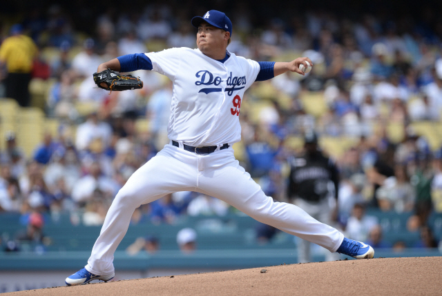▲ September 22, 2019; Los Angeles, CA, USA; Los Angeles Dodgers starting pitcher Hyun-Jin Ryu (99) throws against the Colorado Rockies during the first inning at Dodger Stadium. Mandatory Credit: Gary A. Vasquez-USA TODAY Sports