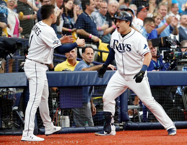 ▲ Oct 7, 2019; St. Petersburg, FL, USA; Tampa Bay Rays first baseman Ji-Man Choi (26) celebrates with shortstop Willy Adames (1) after hitting a home run against the Houston Astros during the third inning in game three of the 2019 ALDS playoff baseball series at Tropicana Field. Mandatory Credit: Kim Klement-USA TODAY Sports
