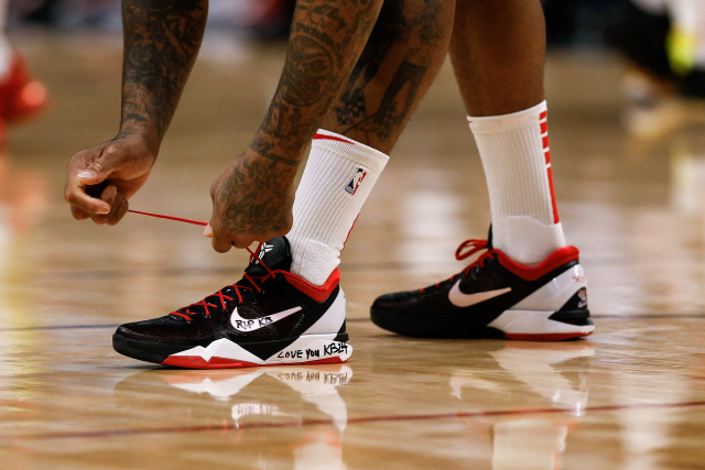 ▲ Jan 26, 2020; Denver, Colorado, USA; Houston Rockets forward P.J. Tucker (17) ties his shoes before the game against the Denver Nuggets the at the Pepsi Center. A tribute for former Lakers player Kobe Bryant is written on the shoes. Mandatory Credit: Isaiah J. Downing-USA TODAY Sports